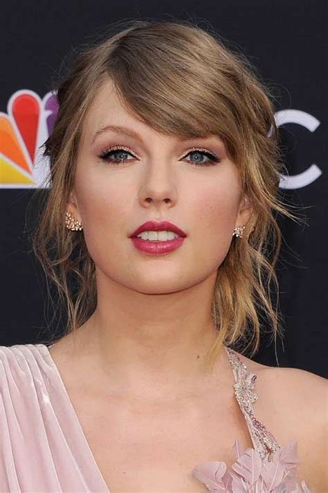 Taylor Swift's Hairstyles & Hair Colors | Steal Her Style