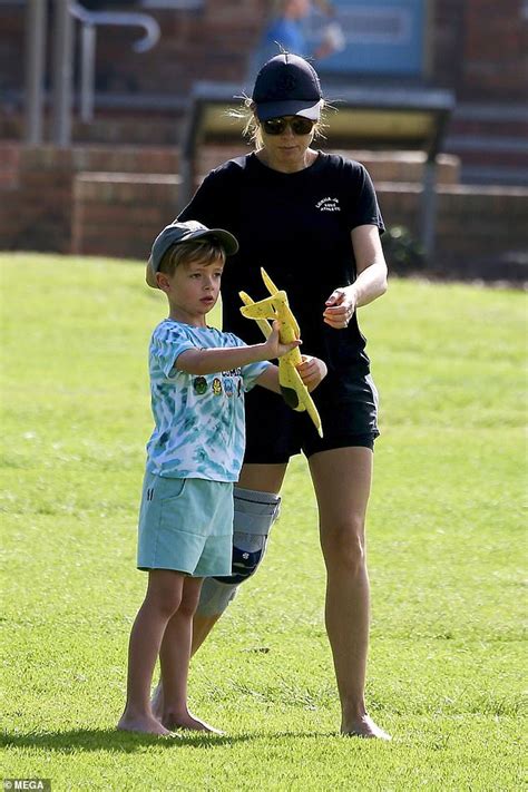 Allison Langdon sports a knee brace while playing with her son Mack ...