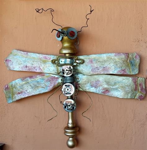 Steampunk Dragonfly Berry, made with turtle bones, wood spindle, doorknob, assorted metal junk ...