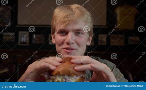 Close Up Young Hungry Man Biting Burger in Fast Food Restaurant Stock Footage - Video of lunch ...