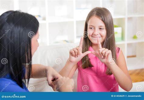 Deaf Girl Learning Sign Language Stock Image - Image of device, medicine: 61454629