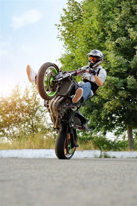 Male Biker Practicing Stunts on a Bike. Editorial Photo - Image of gear ...