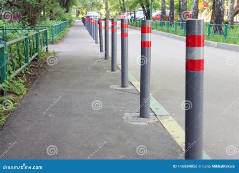 Parking Poles on the Street Stock Photo - Image of outdoors, urban ...