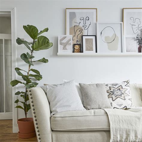 Living room wall art ideas - 10 ways to display prints and paintings | Ideal Home