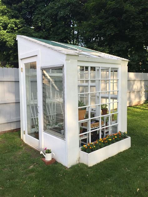 Greenhouse made from our old windows | Garden design, Backyard greenhouse, Greenhouse gardening