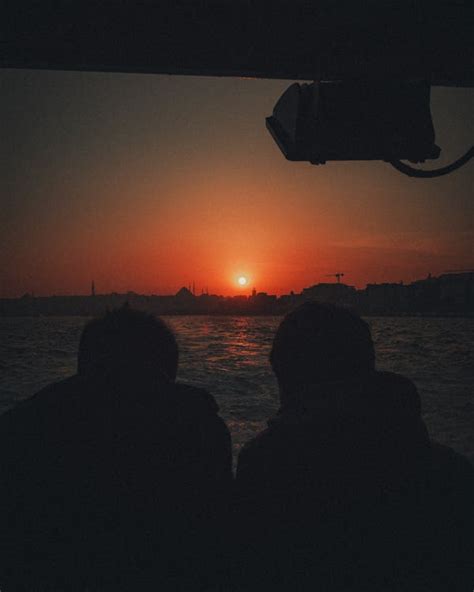 Silhouette of Two People during Sunset · Free Stock Photo