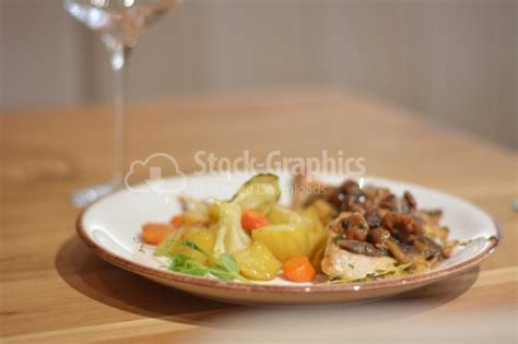 Chicken breast with sauteed mushrooms and vegetable garnish. - Stock Graphics