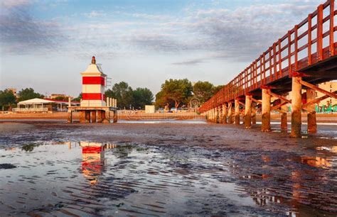 Italy Beach - Lignano Sabbiadoro Lighthouse with Beach at Sunrise Stock Photo - Image of sunrise ...