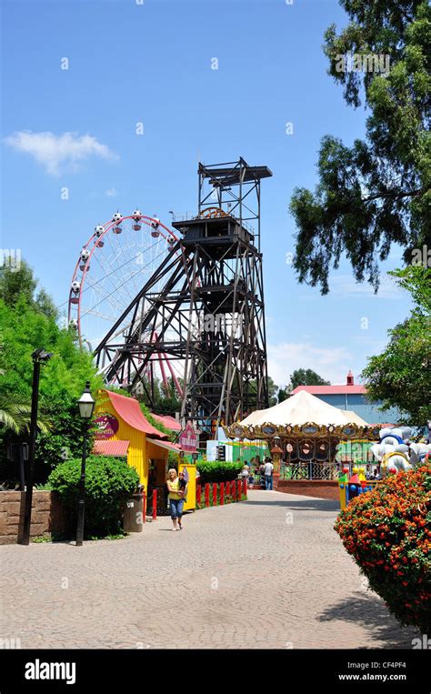 Coal winding gear and children's rides at Gold Reef City Theme Park, Johannesburg, Gauteng ...