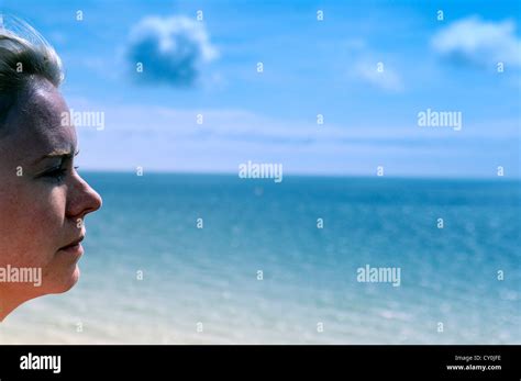 Lady by Ocean Stock Photo - Alamy