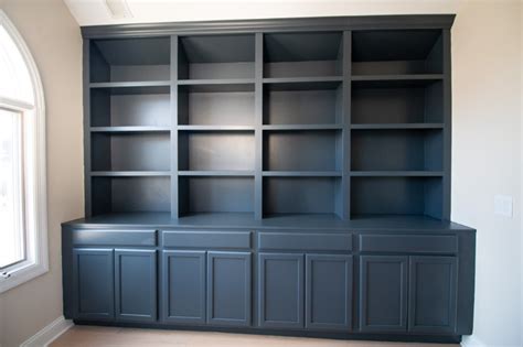 Painting DIY Built-Ins Dark Blue | The DIY Playbook | Painted built ins, Built ins, Blue bookshelves