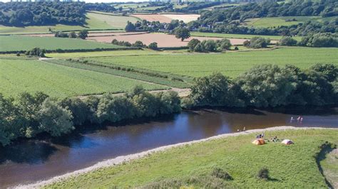 Riverside camping and glamping with canoes for hire, a pub within ...