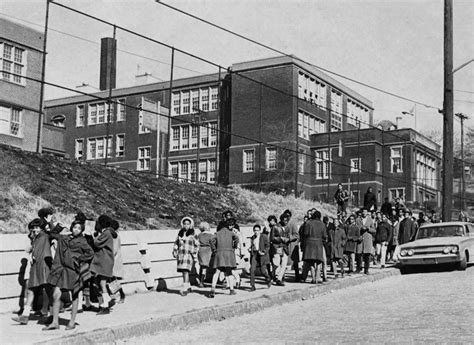 Students walk down Hazelwood Avenue. (Albert Herrmann Jr./The Post-Gazette)