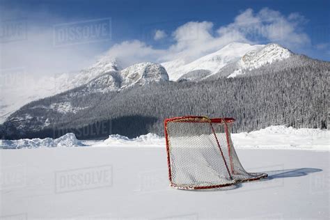 Hockey Net On Outdoor Ice Rink; Lake Louise, Alberta, Canada - Stock Photo - Dissolve