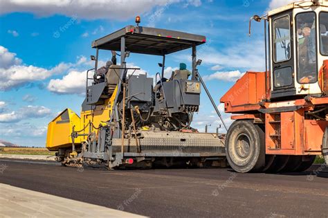 Premium Photo | Asphalt laying equipment Work on the device of a new ...