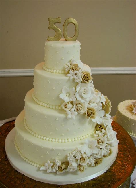 Gold and White! With different flowers | 50th anniversary cakes, Golden ...