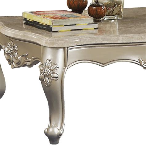 Features: Scalloped marble top Cabriole legs support Scrolled design apron Molded and carved ...
