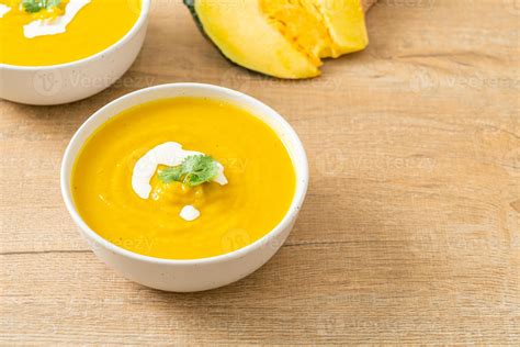 pumpkin soup in white bowl 11219150 Stock Photo at Vecteezy