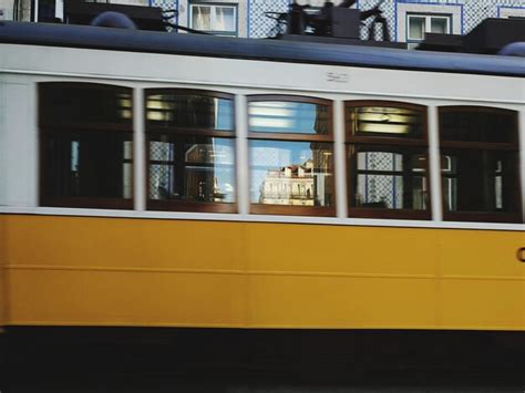 Premium Photo | Reflection of buildings on train window in city