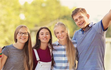 Happy teenagers posing on city street - Medical Associates of Northwest ...