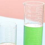 Free Stock image of Two measuring beakers filled with green liquid ...