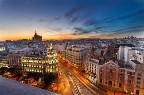 Sunset from a rooftop in Madrid, Spain. Photo by Fabian Van Schepdael . | Sunset spain, Earth ...