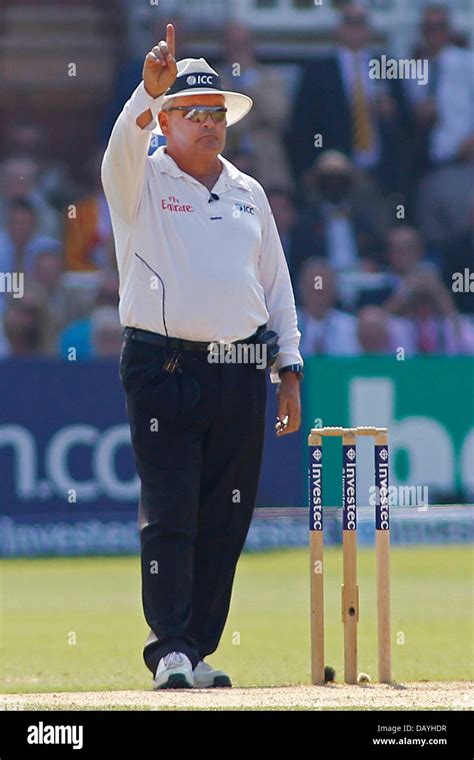 London, UK. 21st July, 2013. Umpire Marais Erasmus signals out after reversing his decision ...