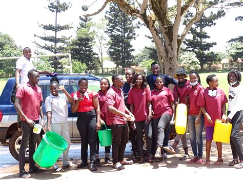 UCU students wash cars to raise money for sanitary pads - Uganda ...