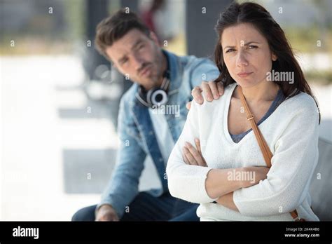 couple breaking up sitting on bench Stock Photo - Alamy