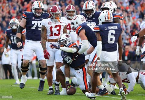 Damari Alston of the Auburn Tigers reacts after rushing for a... News ...