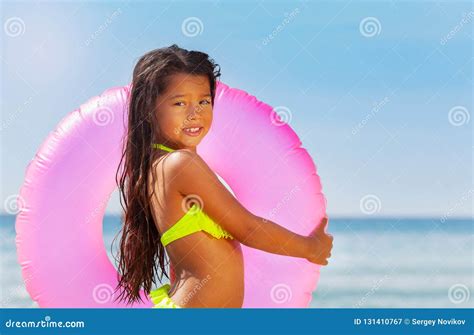 Little Asian Girl with Swimming Ring on the Beach Stock Image - Image ...