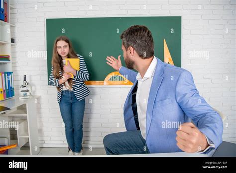 angry teacher shouting at child at blackboard. aggression Stock Photo ...