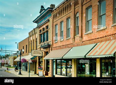 Historic old brick buildings revitalized for downtown shopping area revealing small town ...