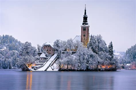 Photo Gallery: Lake Bled draped in winter white in the winter