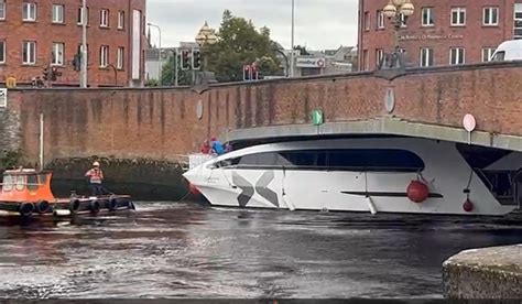 WATCH: Boat has lucky escape after getting stuck under Limerick bridge ...