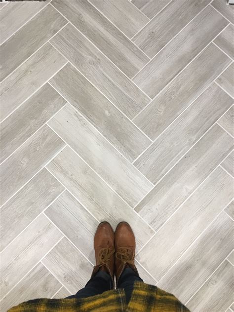 Lowe's vintage gray wood look tile in herringbone pattern with silver grout from menards | Wood ...