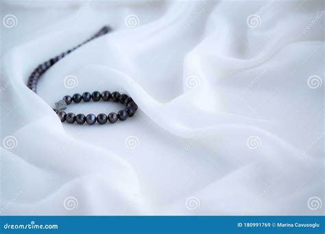 Black Pearls on White Silk Background. Stock Image - Image of pearl, drapery: 180991769