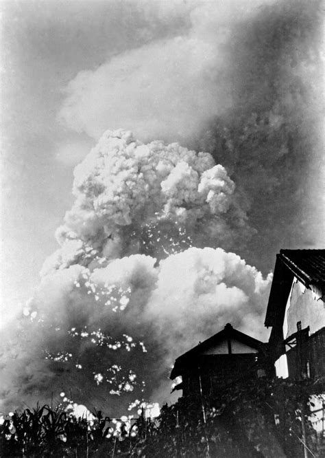 A massive mushroom cloud rises above Hiroshima, Japan, two minutes ...