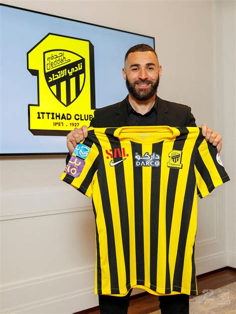 Karim Benzema poses with Al Ittihad jersey