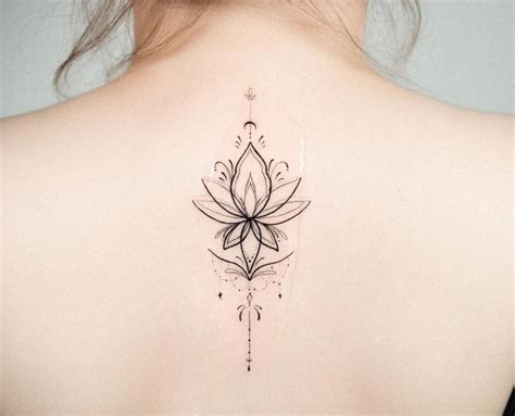 Ornamental lotus flower tattoo on the upper back