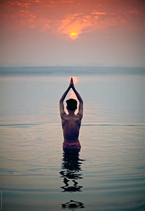 "Man Praying In The Holy River At Sunrise, River Ganges (Ganga ...