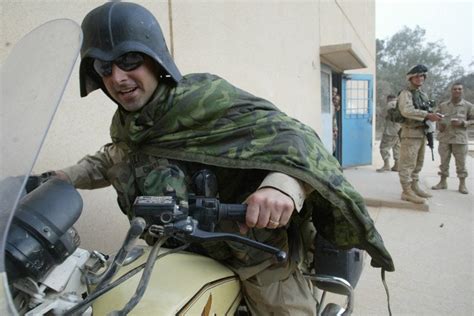 US soldier wearing a captured Iraqi Fedayeen helmet xpost /r ...