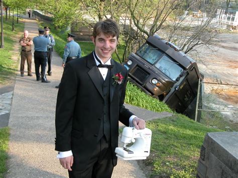 The guy holding a sewing machine, in front of a UPS Truck Accident (the unexplainable picture ...