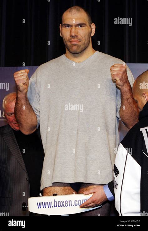 (dpa) - Russian boxer Nikolai Valuev raise their fists as he stands on ...