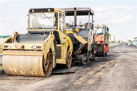 Premium Photo | Asphalt paving equipment. Asphalt paver and heavy ...