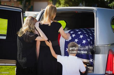 Grieving Family At A Funeral High-Res Stock Photo - Getty Images