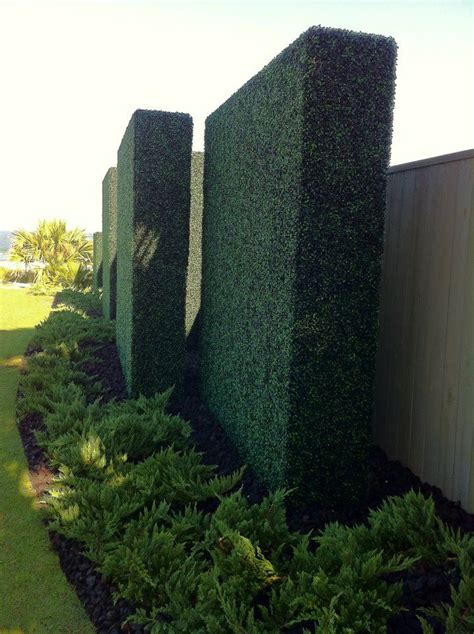 Hedge walls. They're artificial an maintenance-free, but remain every ...