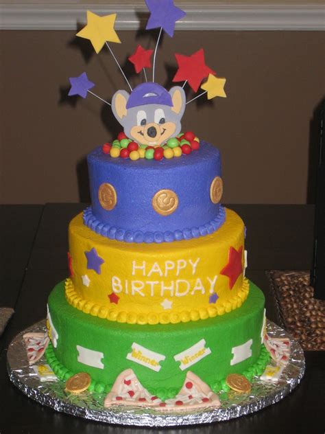 chuck e cheese cake - Chuck E Cheese themed cake. Cake iced with buttercream. Decorations are ...