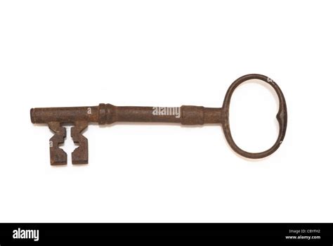 rusty old door key on white background Stock Photo - Alamy