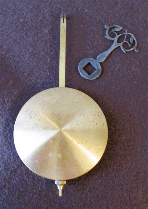 4.5 Ounce 5 3/4 Antique Brass & Steel Clock Pendulum Stk# 247